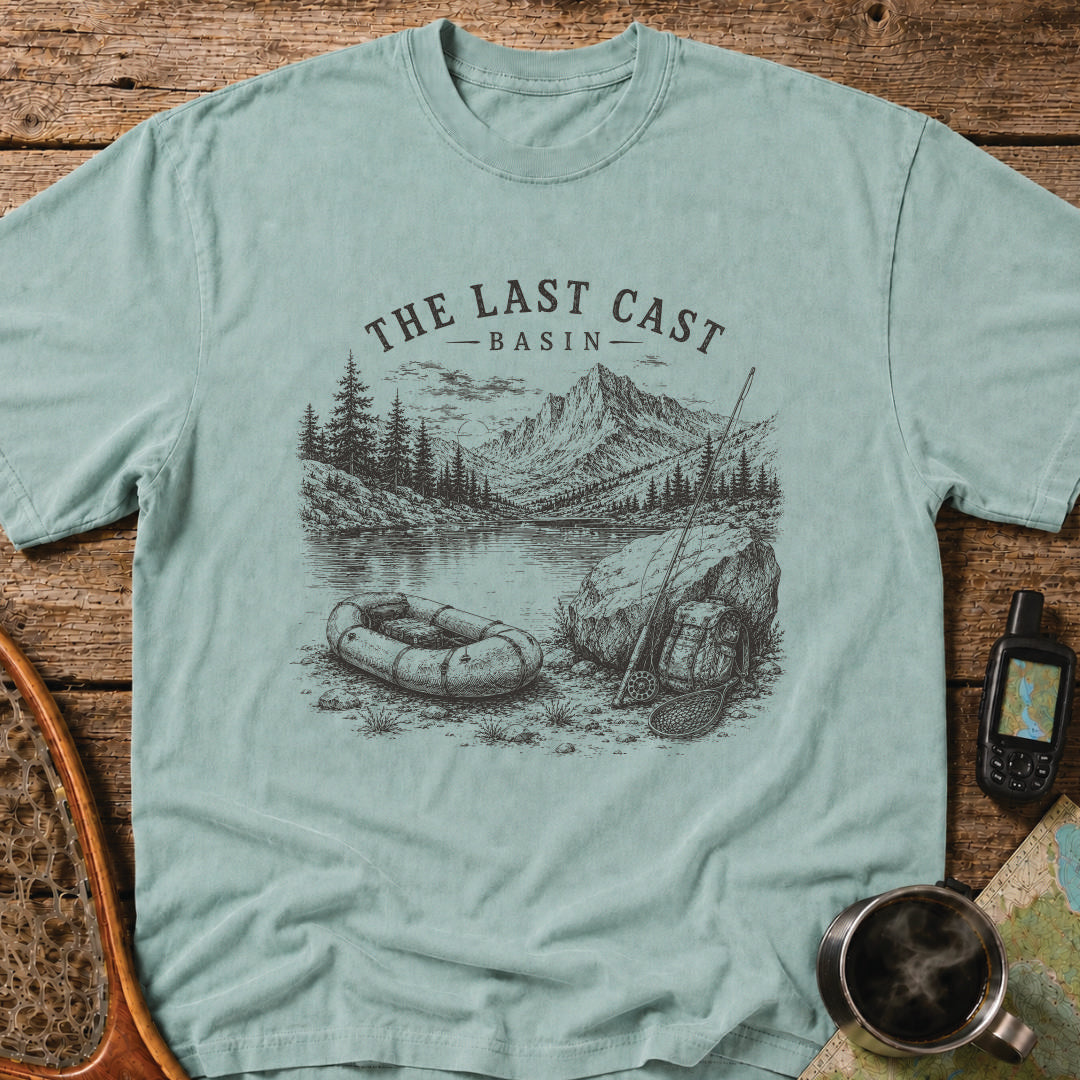 Packraft, fly rod, and remote alpine lake surrounded by rugged mountain peaks.