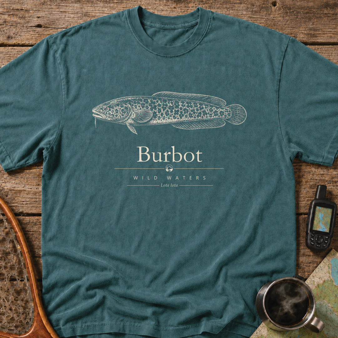 Blue Spruce Comfort Colors T-shirt featuring a vintage cream burbot illustration, Wild Waters typography, and the scientific name Lota lota.
