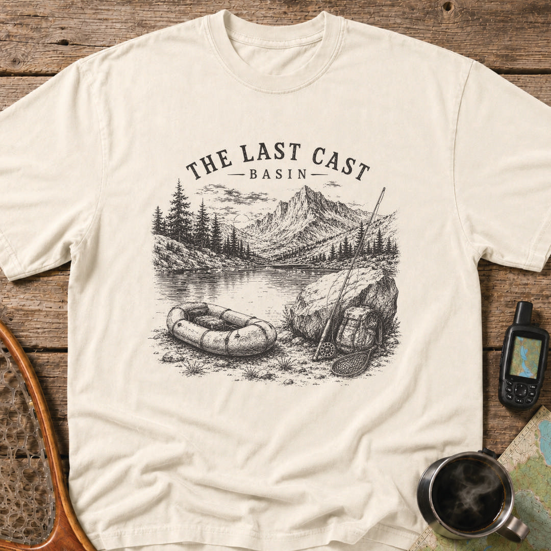 Packraft, fly rod, and remote alpine lake surrounded by rugged mountain peaks.