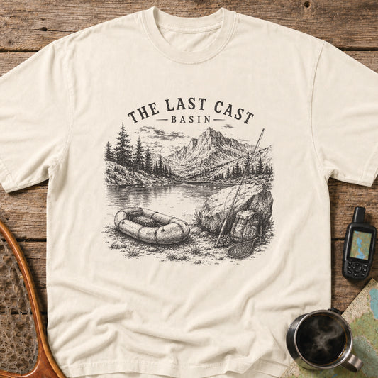 Packraft, fly rod, and remote alpine lake surrounded by rugged mountain peaks.