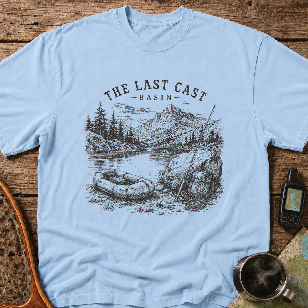 Packraft, fly rod, and remote alpine lake surrounded by rugged mountain peaks.