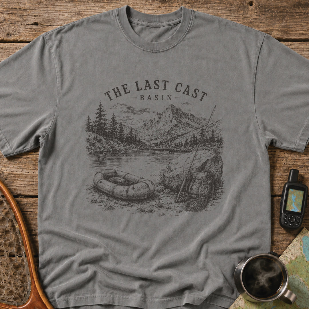 Packraft, fly rod, and remote alpine lake surrounded by rugged mountain peaks.