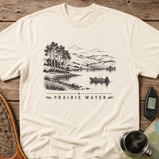 Small fishing boat drifting on a quiet prairie lake surrounded by rolling hills.